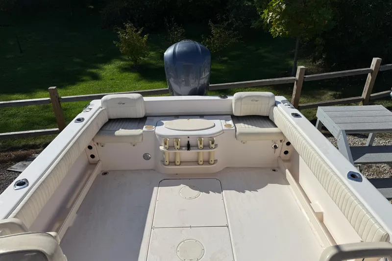 Slide: The Image of 2008 Grady-White Seafarer 228 boat interior with seating and rod holders. - 4