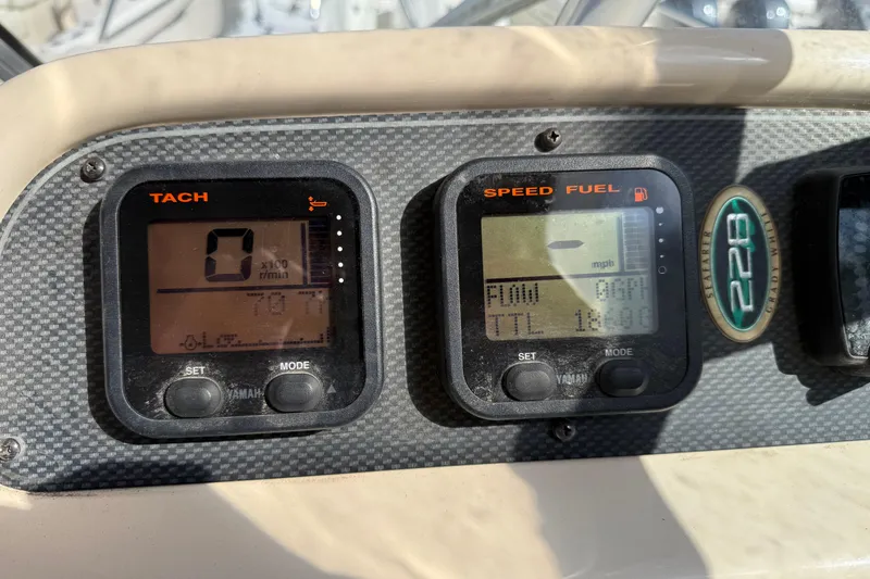 Slide: The Image of Dashboard of 2008 Grady-White Seafarer 228 with tachometer and speed fuel gauges. - 6