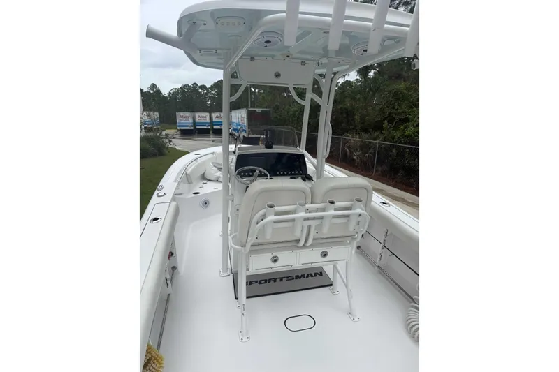 Slide: The Image of 2020 Sportsman Open 232 Center Console boat with dual seats and steering console. - 1