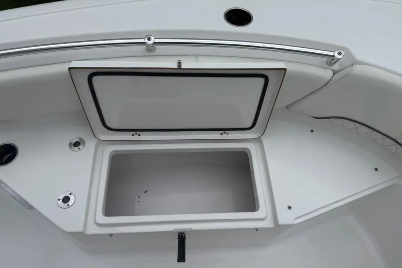Slide: The Image of 2020 Sportsman Open 232 Center Console boat with open storage compartment. - 10