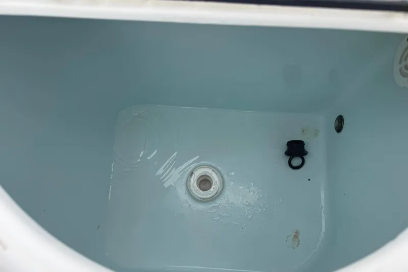 Slide: The Image of Livewell interior of 2020 Sportsman Open 232 Center Console boat. - 13