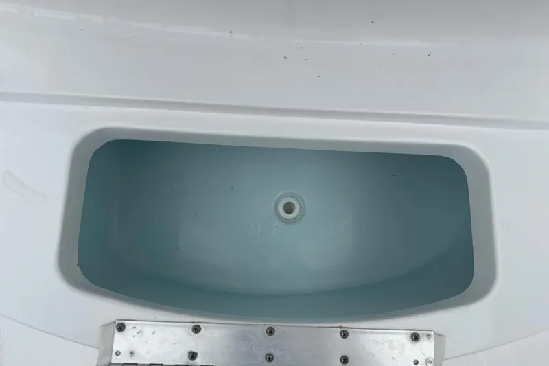 Slide: The Image of Livewell compartment on a 2020 Sportsman Open 232 Center Console boat. - 14