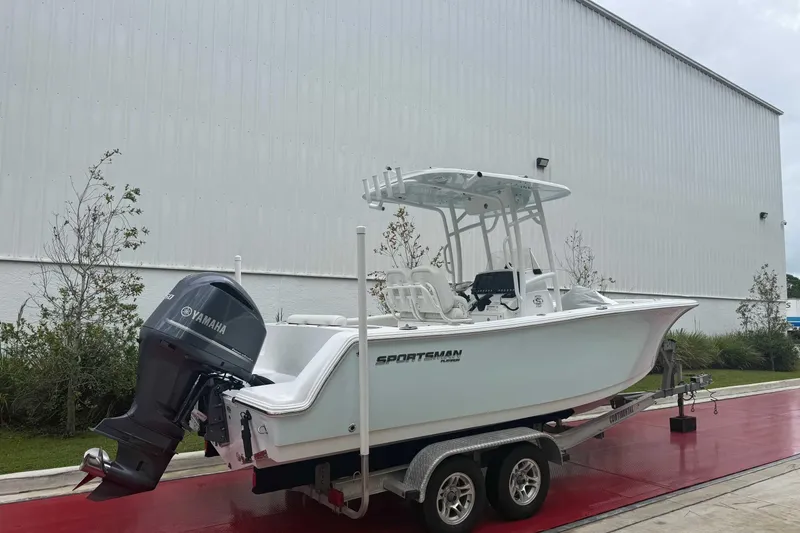 Slide: The Image of 2020 Sportsman Open 232 Center Console boat on trailer, featuring Yamaha outboard motor. - 16