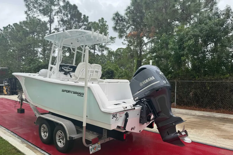 Slide: The Image of 2020 Sportsman Open 232 Center Console boat on trailer with Yamaha engine. - 18