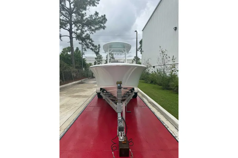 Slide: The Image of 2020 Sportsman Open 232 Center Console boat on trailer, parked outdoors. - 19