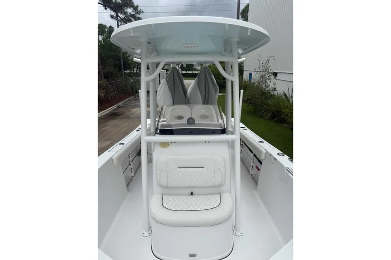 Slide: The Image of 2020 Sportsman Open 232 Center Console boat with T-top and cushioned seating. - 5