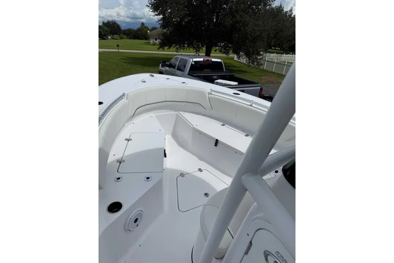 Slide: The Image of 2020 Sportsman Open 232 Center Console boat interior with seating and storage compartments. - 6