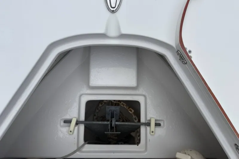 Slide: The Image of Anchor storage compartment on a 2020 Sportsman Open 232 Center Console boat. - 7