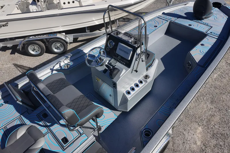 Slide: The Image of 2026 Xpress H24B Bay boat interior with modern console and seating. - 10
