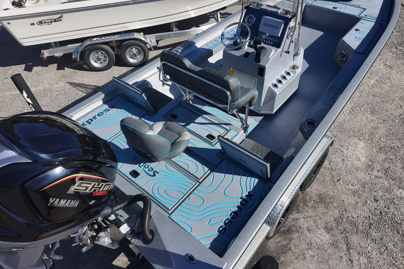 Slide: The Image of 2026 Xpress H24B Bay boat with Yamaha engine, featuring modern design and advanced navigation system. - 9
