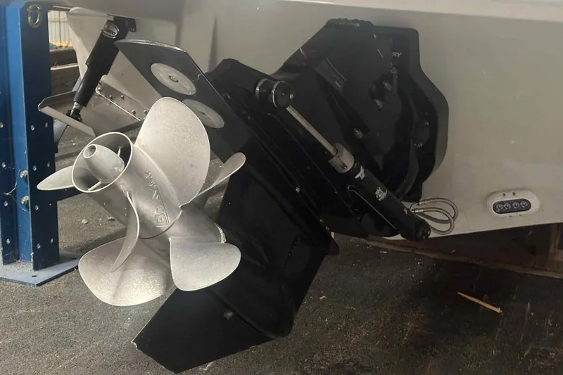 Slide: The Image of 2021 Crownline 290 SS boat in storage, featuring "TAZ" graphic on the side. - 6