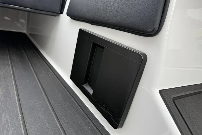 Slide: The Image of 2025 Moomba Max interior detail with black panel and cushioned seating. - 11