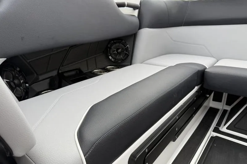 Slide: The Image of 2025 Moomba Max interior seating with black and white upholstery and built-in speakers. - 7