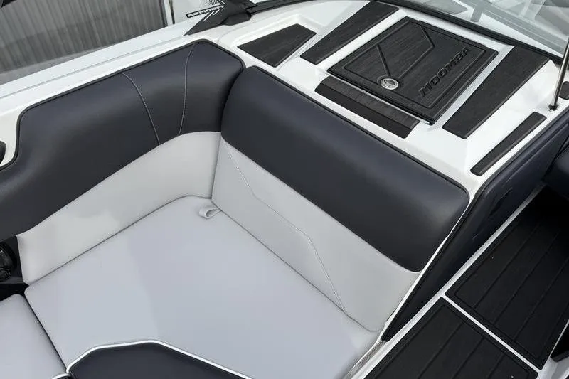 Slide: The Image of 2025 Moomba Max boat interior with sleek black and white seating design. - 9