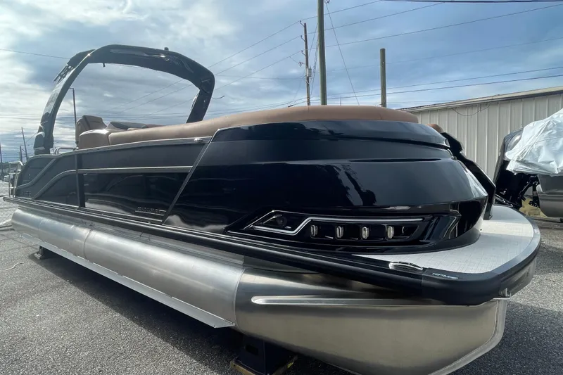 The Image of 2026 Harris Grand Mariner 250 pontoon boat with sleek black design and modern features. - 0
