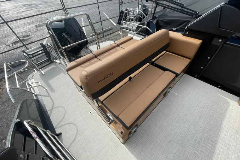 Slide: The Image of 2026 Harris Grand Mariner 250 boat interior with tan seating and sleek design. - 11