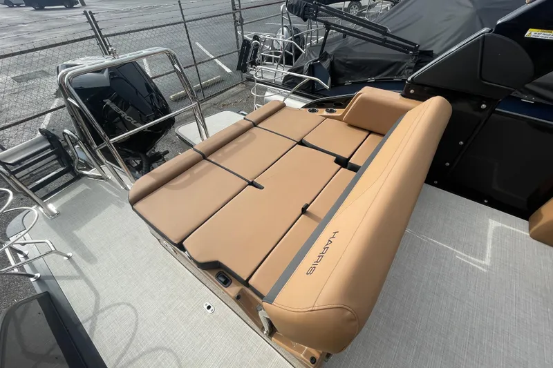 Slide: The Image of 2026 Harris Grand Mariner 250 boat with tan seating and sleek design. - 13