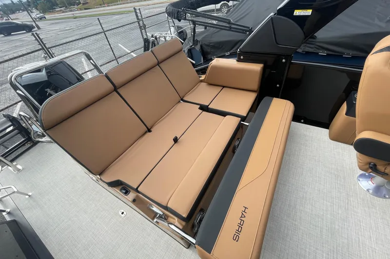 Slide: The Image of 2026 Harris Grand Mariner 250 boat interior with tan seating and modern design. - 14