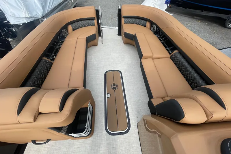 Slide: The Image of Luxurious interior of 2026 Harris Grand Mariner 250 pontoon boat with tan seating. - 17