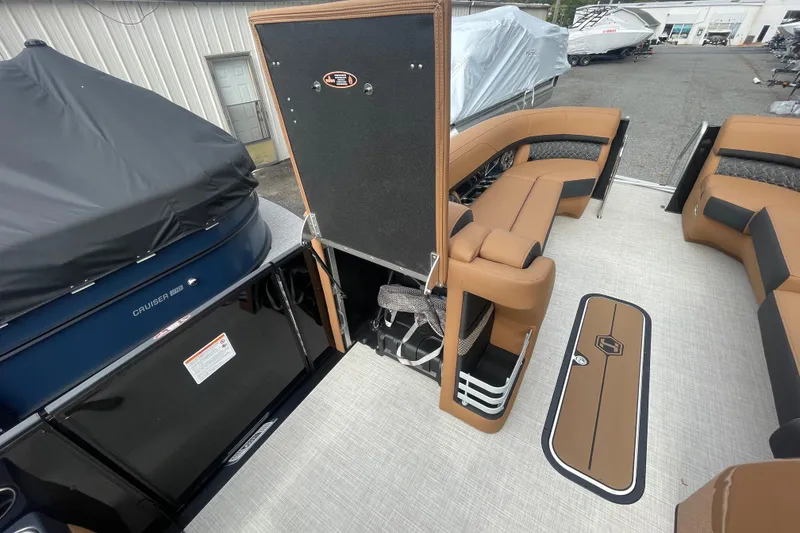 Slide: The Image of 2026 Harris Grand Mariner 250 interior with tan seating and modern design elements. - 18