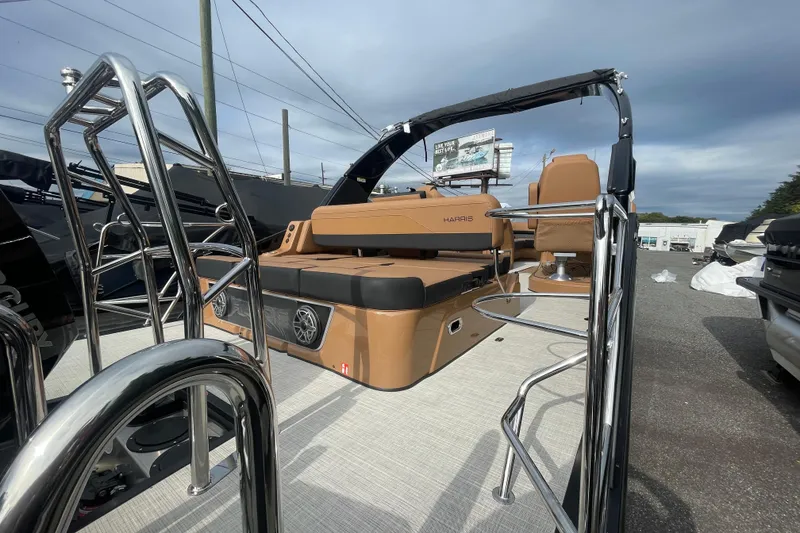 Slide: The Image of 2026 Harris Grand Mariner 250 pontoon boat with sleek seating and stainless steel railings. - 19