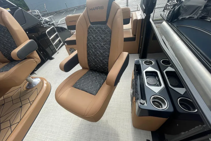 Slide: The Image of 2026 Harris Grand Mariner 250 interior with luxurious seating and cup holders. - 9