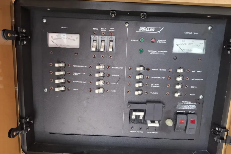 Slide: The Image of Electrical control panel of a 2002 Boston Whaler 295 Conquest boat. - 16
