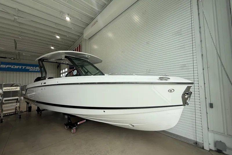 The Image of 2026 Monterey Elite 30 OB boat displayed indoors, showcasing sleek design and modern features. - 0