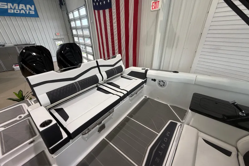 Slide: The Image of 2026 Monterey Elite 30 OB boat interior with sleek seating and modern design. - 22
