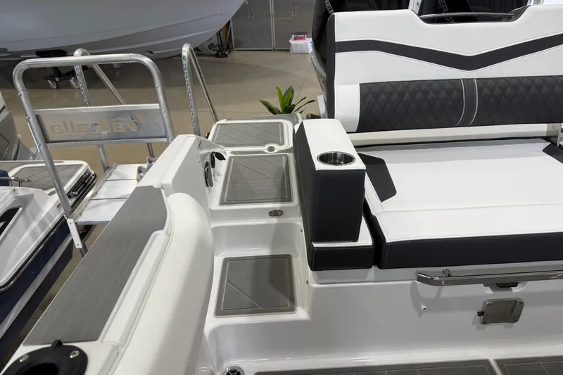 Slide: The Image of 2026 Monterey Elite 30 OB boat interior with sleek seating and modern design. - 23