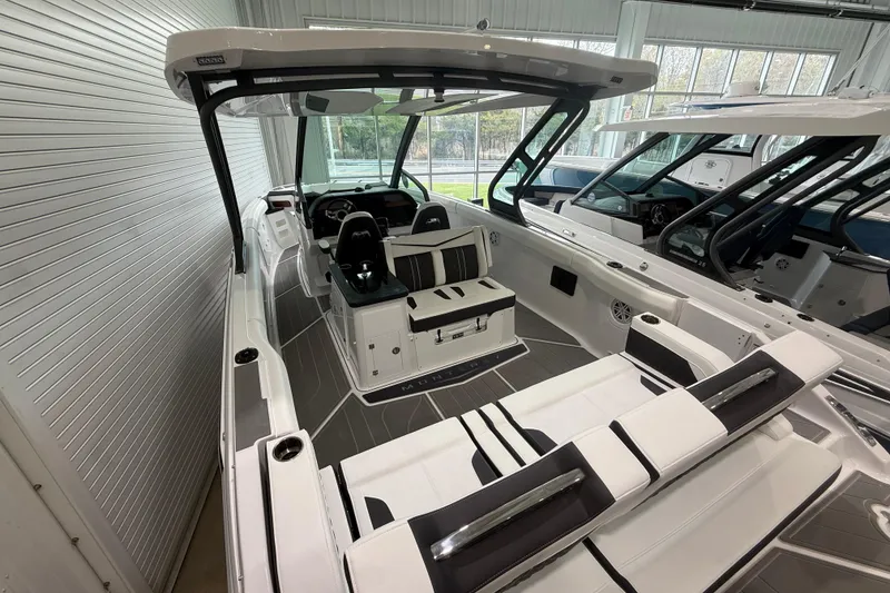 Slide: The Image of 2026 Monterey Elite 30 OB boat interior with sleek seating and modern design. - 25