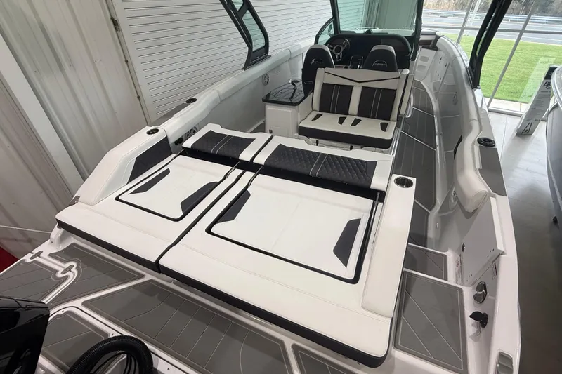 Slide: The Image of 2026 Monterey Elite 30 OB boat interior with sleek seating and modern design. - 28