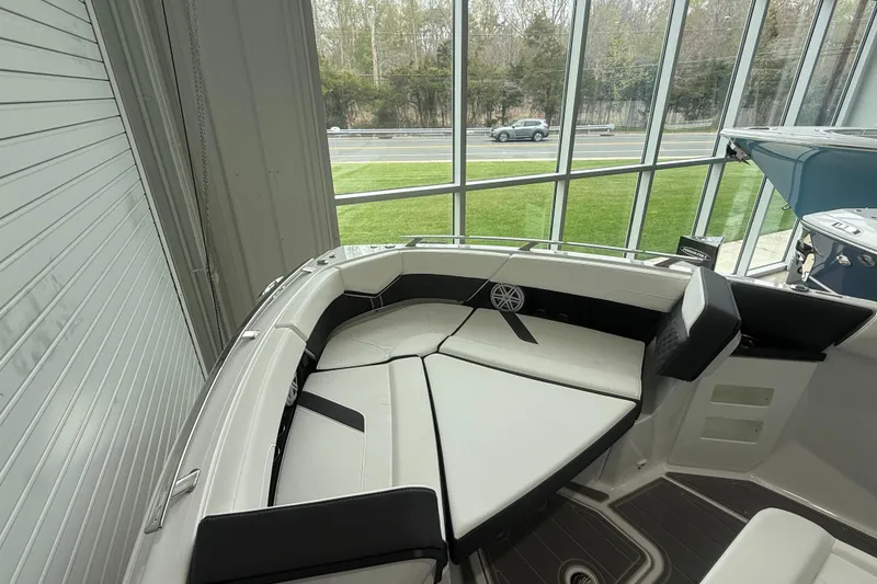Slide: The Image of 2026 Monterey Elite 30 OB boat interior with sleek seating and modern design. - 7