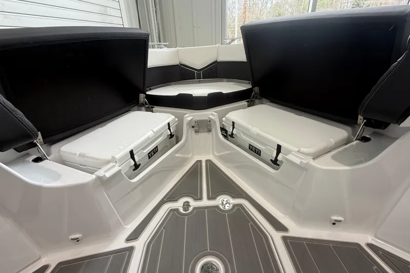 Slide: The Image of Interior of 2026 Monterey Elite 30 OB boat with Yeti coolers and seating. - 9