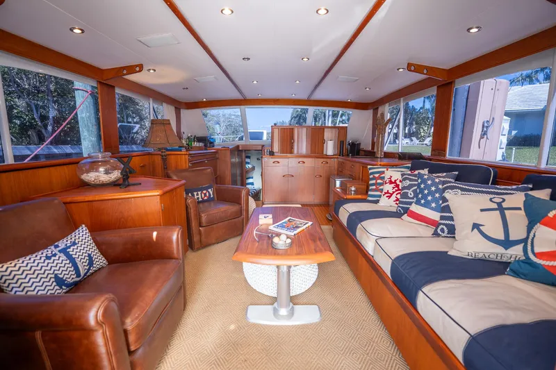 Slide: The Image of Luxurious 1970 Rybovich 54 yacht interior with leather seating and nautical-themed decor. - 21