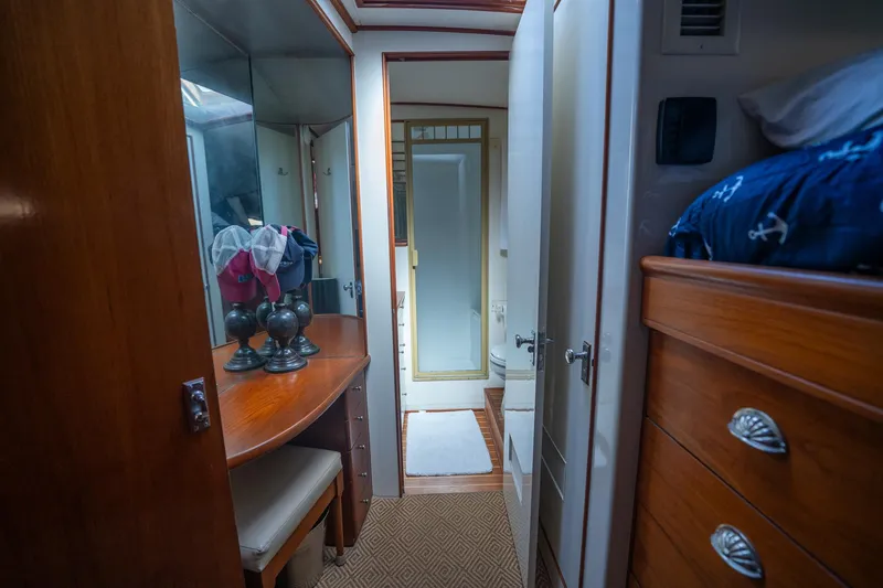 Slide: The Image of Interior of 1970 Rybovich 54 yacht with wooden furnishings and cozy cabin space. - 32