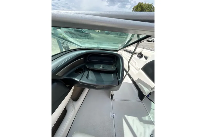 Slide: The Image of 2004 Crownline 202 BR boat interior with dashboard and seating area. - 14