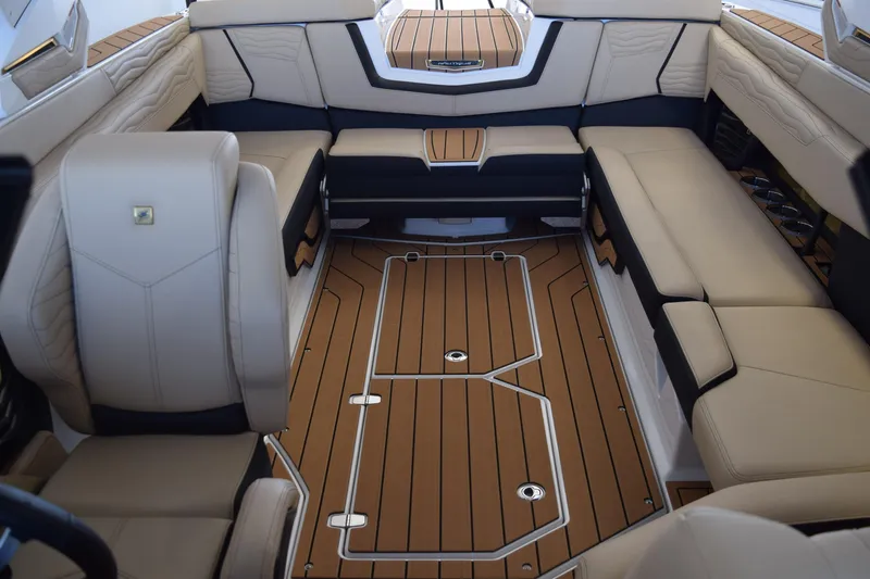 Slide: The Image of Luxurious interior of 2026 Nautique Super Air Nautique G25 Paragon boat with plush seating. - 14