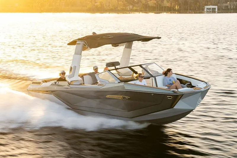 Slide: The Image of Manufacturer Provided Image: 2026 Nautique Super Air Nautique G25 Paragon cruising on a sunlit lake. - 22