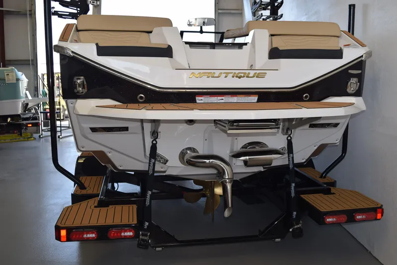 Slide: The Image of 2026 Nautique Super Air Nautique G25 Paragon boat rear view in showroom. - 4
