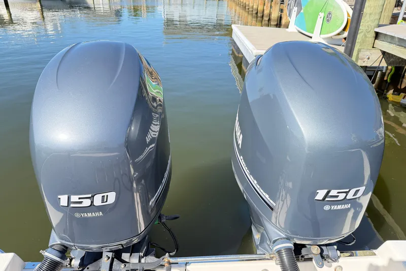 Slide: The Image of Twin Yamaha 150 outboard engines on a 2014 Robalo R245 Walkaround boat. - 45