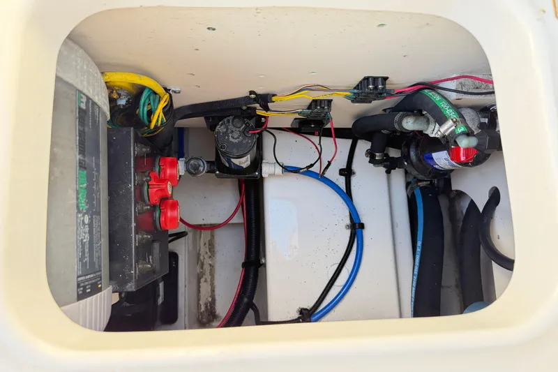 Slide: The Image of 2014 Robalo R245 Walkaround boat wiring and battery compartment. - 7