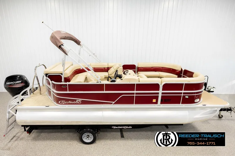 Slide: The Image of 2018 Misty Harbor 2085 CR pontoon boat with Mercury engine, displayed indoors. - 1