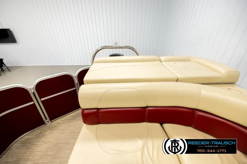 Slide: The Image of 2018 Misty Harbor 2085 CR boat interior with beige and red seating, Reeder-Trausch Marine logo. - 15