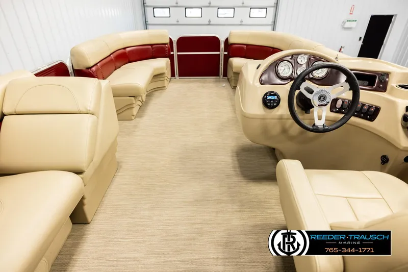Slide: The Image of 2018 Misty Harbor 2085 CR boat interior with beige and red seating, steering console, and controls. - 17