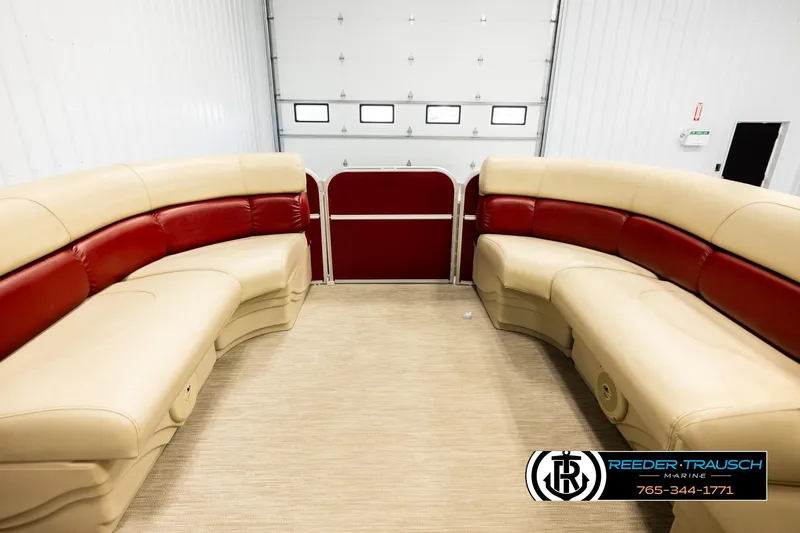 Slide: The Image of 2018 Misty Harbor 2085 CR pontoon boat interior with beige and red seating. - 18