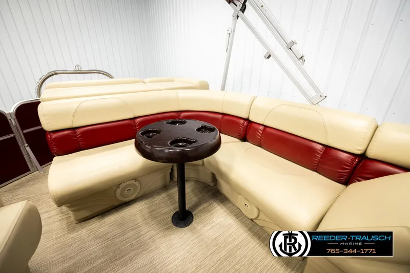 Slide: The Image of 2018 Misty Harbor 2085 CR pontoon boat interior with beige and red seating, cupholder table. - 21