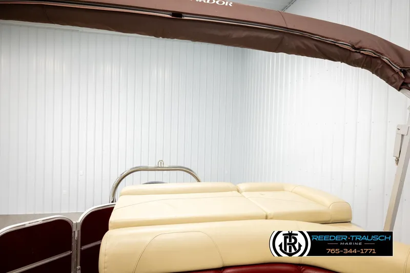 Slide: The Image of 2018 Misty Harbor 2085 CR boat with beige seating and brown canopy. - 23