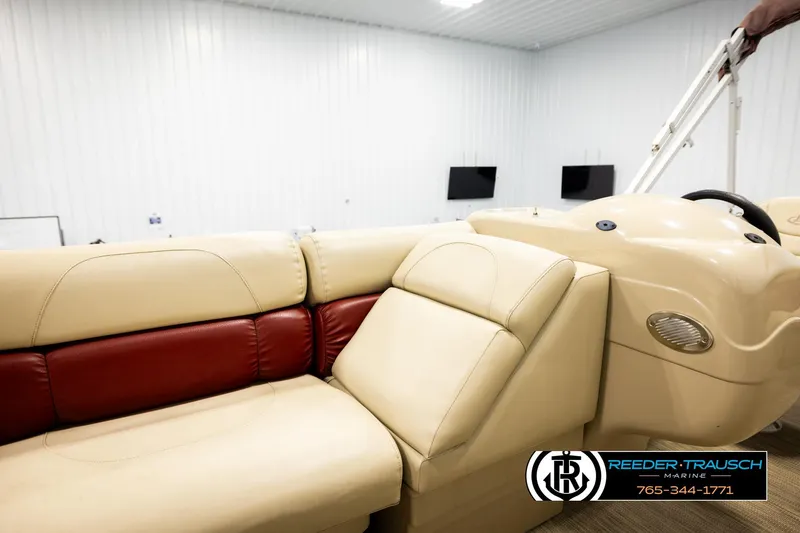 Slide: The Image of 2018 Misty Harbor 2085 CR boat interior with beige and red seating, Reeder-Trausch Marine logo. - 25