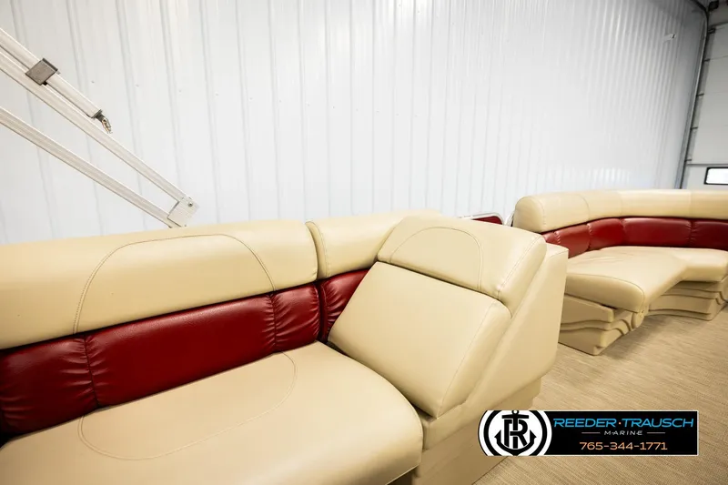 Slide: The Image of 2018 Misty Harbor 2085 CR boat interior with beige and red seating, Reeder-Trausch Marine logo. - 27